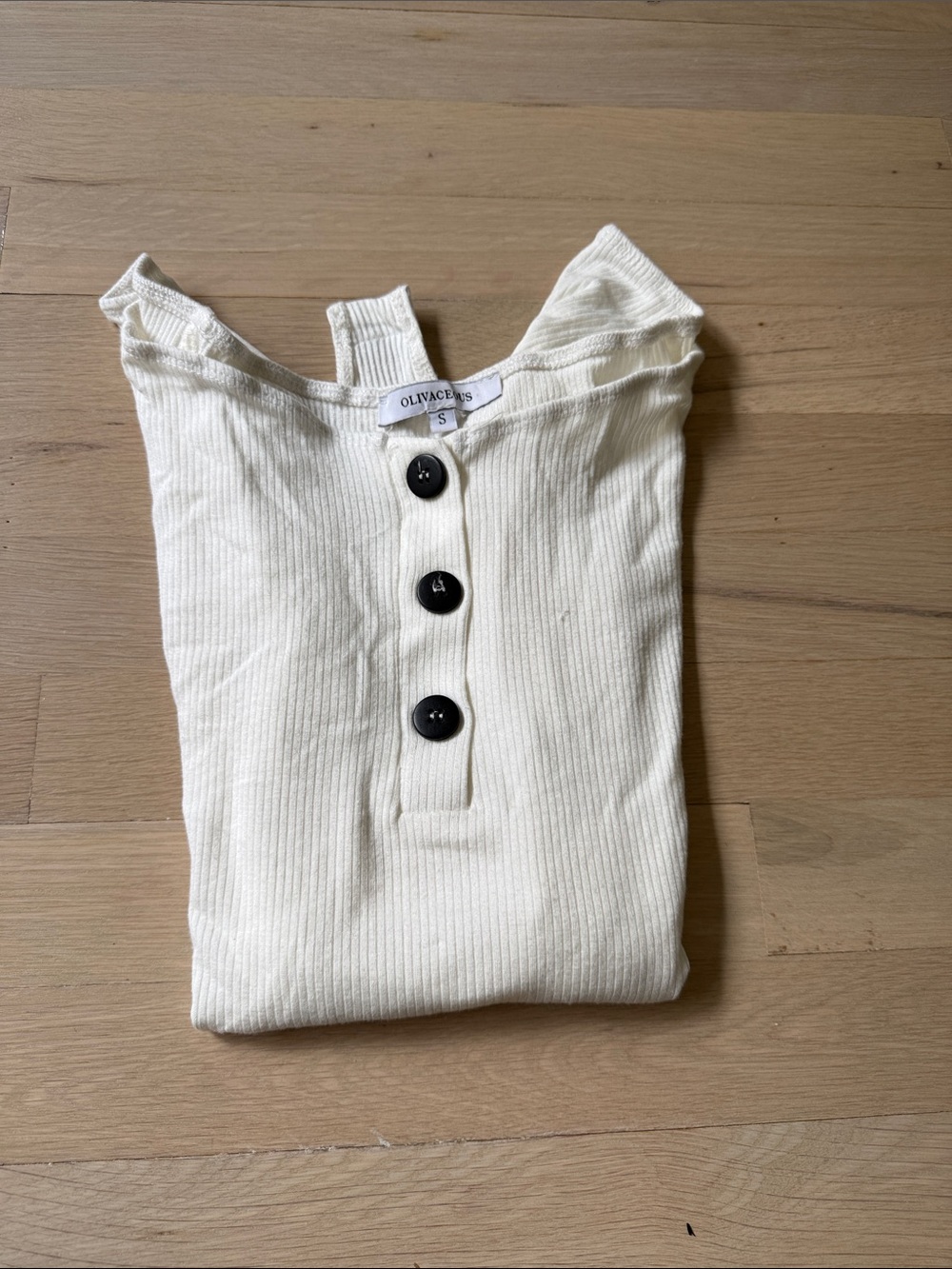 Olivaceous Off-Shoulder Ribbed Button-Front Bodysuit in Cream